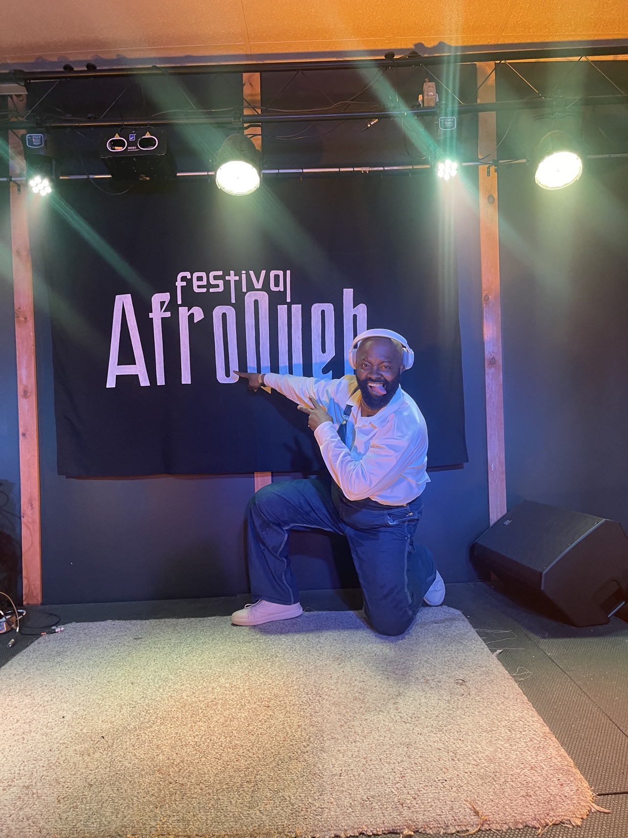 In front of the banner of the AfroQueb Festival