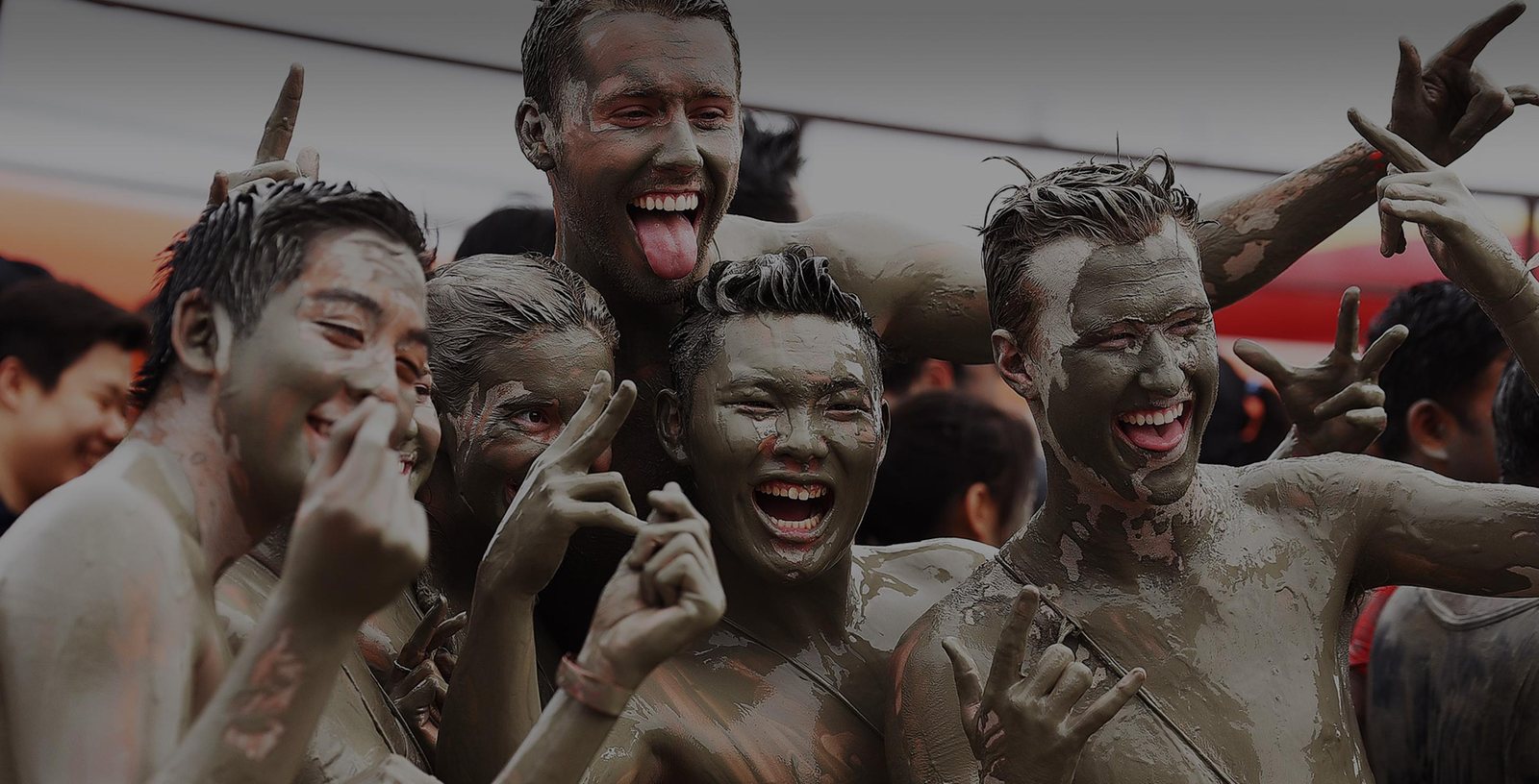 Mud-covered festivalgoers, hilarious, at the Boryeong Mud Festival