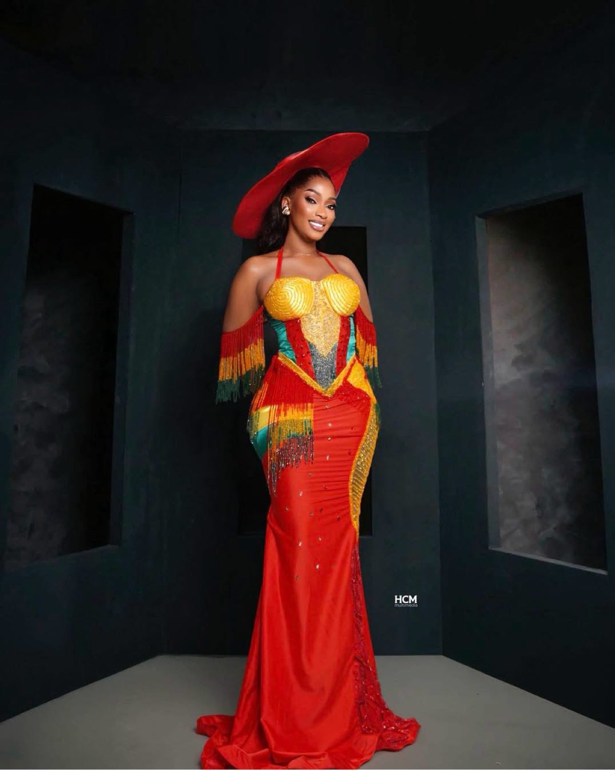 Full foot — red, yellow and green dress