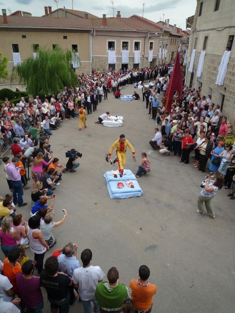 El Colacho jumps over the mattresses of babies in the street of Castrillo de Murcia