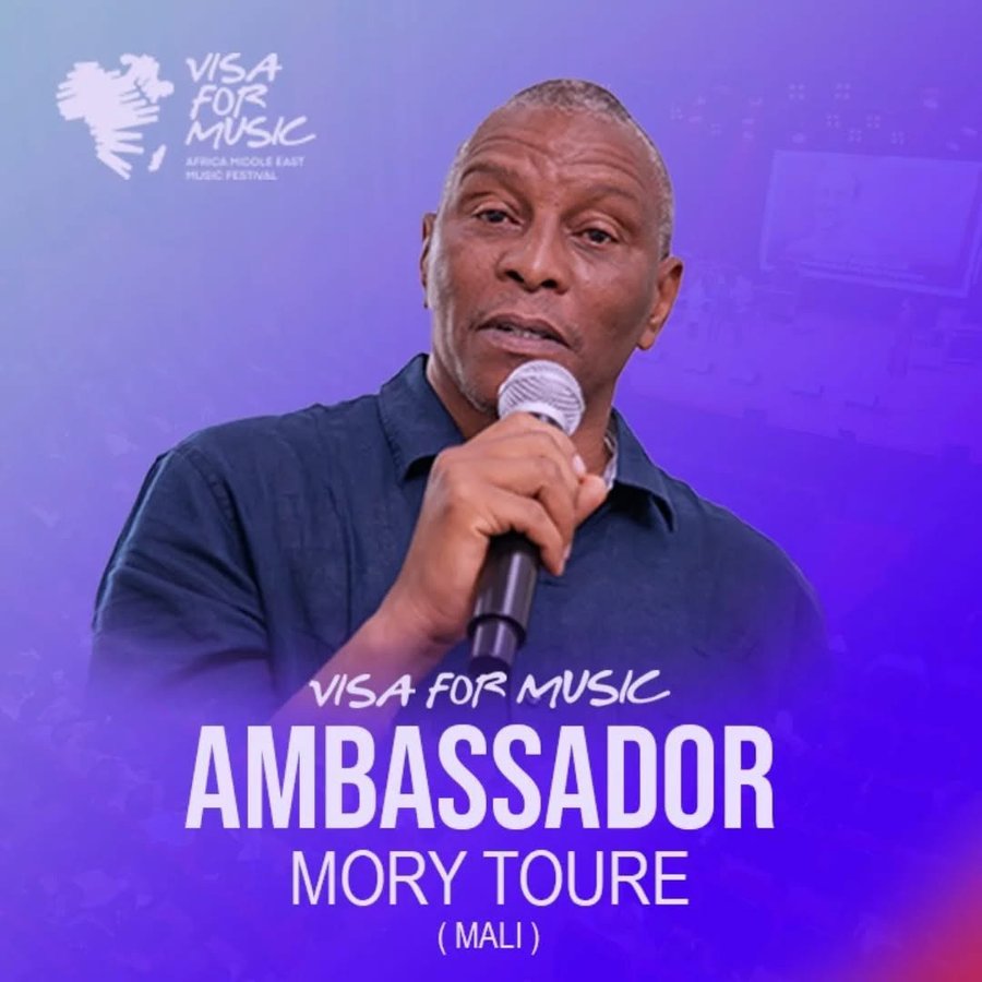 Visuel officiel Visa For Music : « Ambassador Mory Toure (Mali) », micro en main sur fond violet