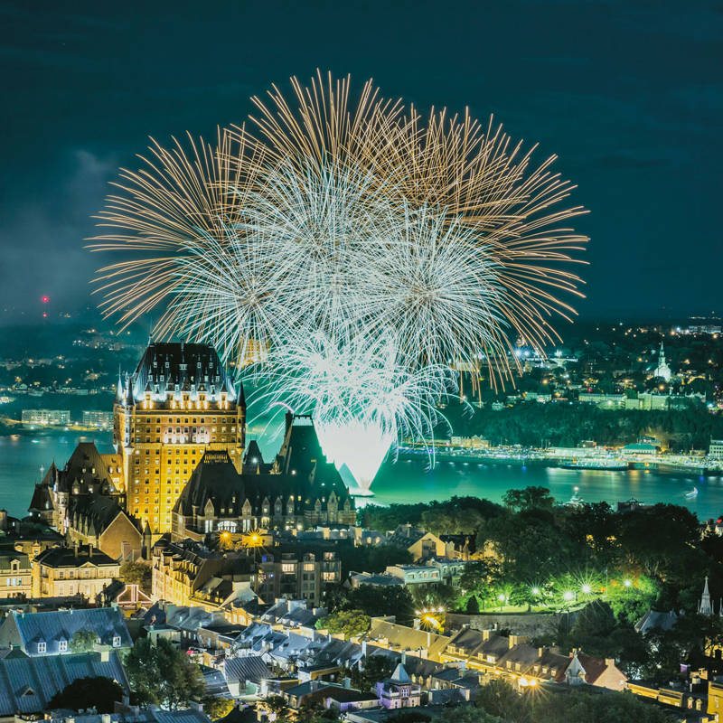 Fireworks of the Grands Feux Loto-Québec above the river, in front of the Château Frontenac