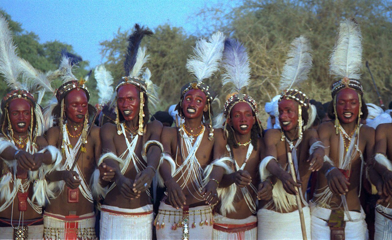 Yaake dancers: face painted in red ochre, white feathers and pearl necklaces