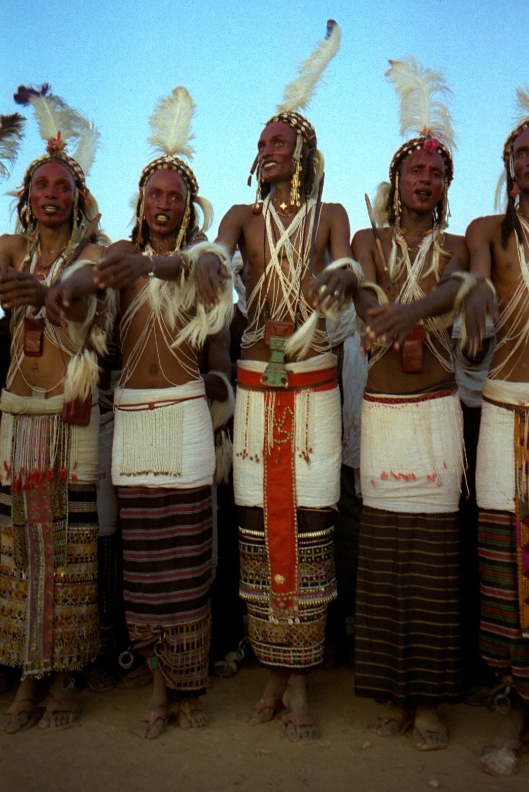 Guérewol dancers in full suit, cross beads and ostrich feathers