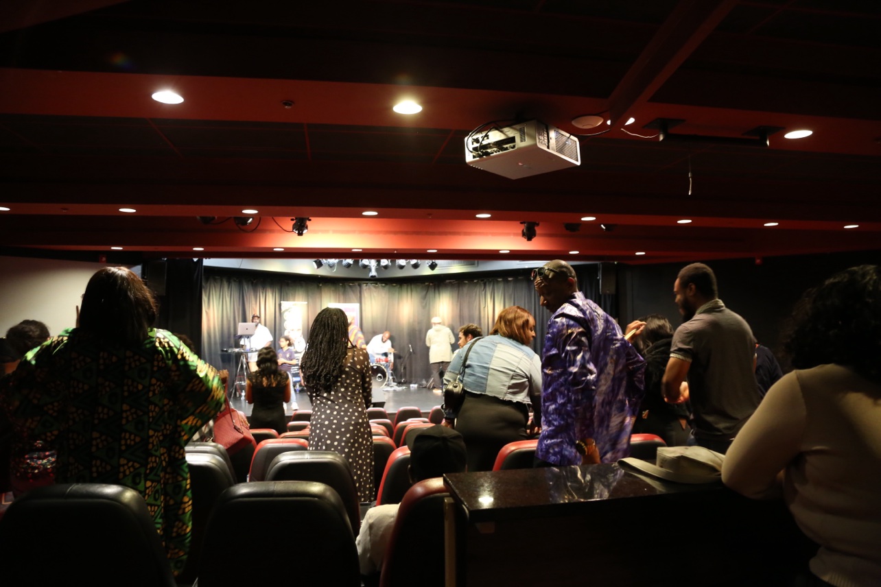 The room from the back, standing public