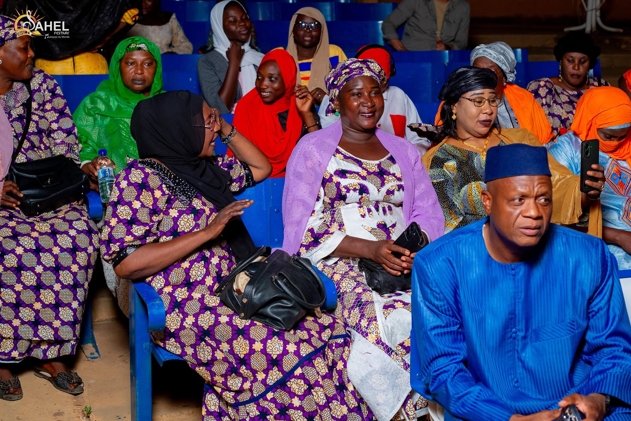 The audience of the Sahel Festival in Niamey, women in colorful outfits