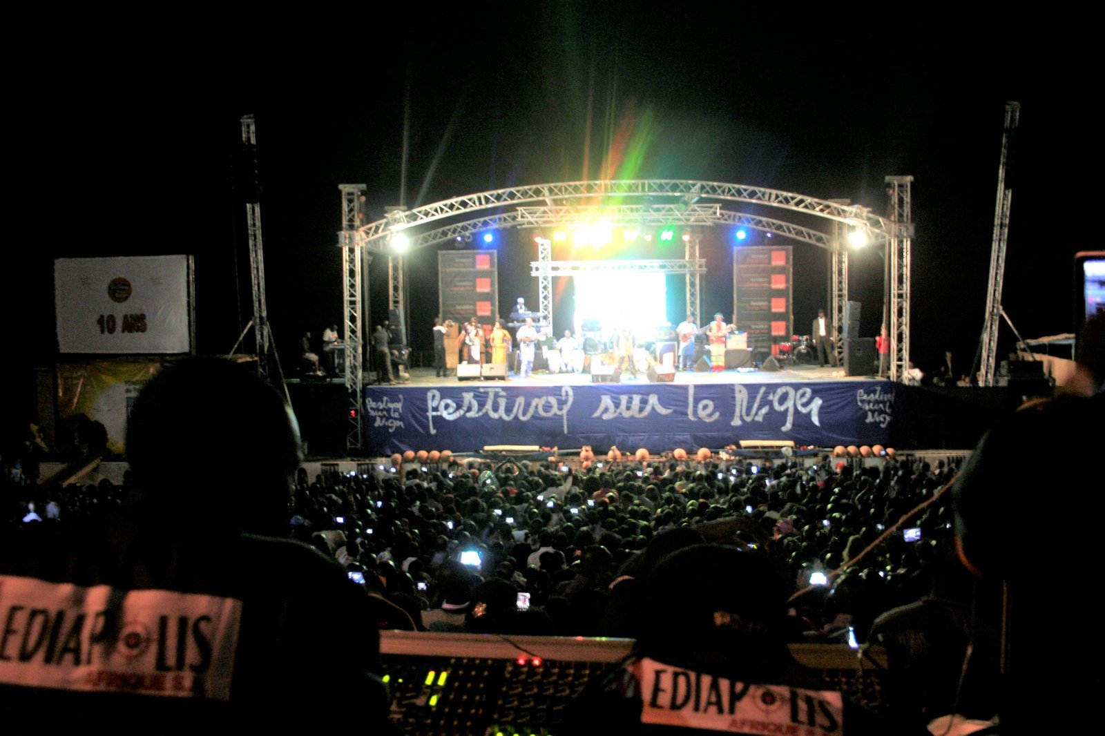 The festival's big scene, at night, in front of the crowd of banks