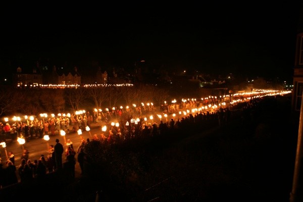 The torch procession descends King Harald Street and bypasses St Olaf Street in Lerwick